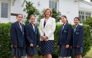 Image showing Principal Christine Harding with four OLMC Burraneer students